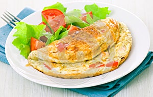 Omelet with vegetable salad