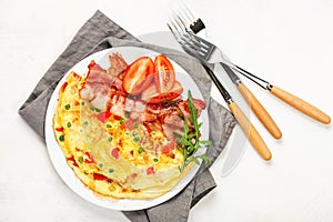 Omelet with vegetables and bacon