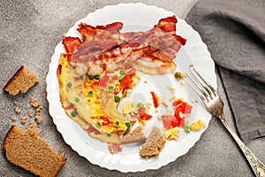 Omelet with vegetables and bacon