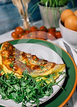 Omelete and ruccola leaves