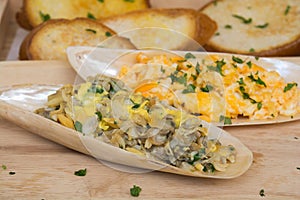 Omelets with Butter clams on shell and bread Serving style