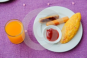 Omelette with bacon, sausage and oragne juice