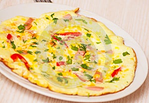Omelette with ham, vegetables and cheese