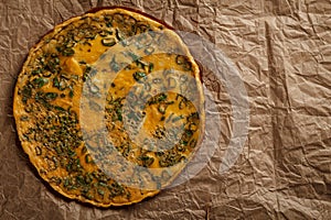 Omelette on old crumpled paper