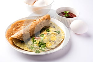 Omelette / omelette chapati roll or Indian bread or roti rolled with omlet.