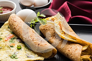 Omelette / omelette chapati roll or Indian bread or roti rolled with omlet.