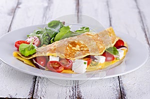 Omelette with tomatoes and cheese