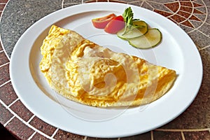 Omelette with tomatoes and cucumbers