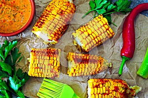 ÃÂomemade corn baked with chilli sauce. Baked corn with chili sauce.