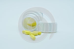 Omeprazole pills and pill bote with white background. photo