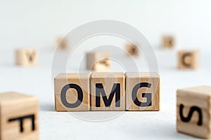 OMG - acronym from wooden blocks with letters