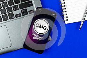 OMG coin symbol. Trade with cryptocurrency, digital and virtual money, banking with mobile phone concept. Business