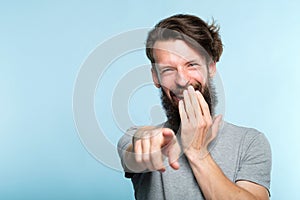 Omg man mocking laughing point finger sneer abuse photo