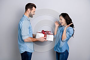 Omg Profile side view photo of surprised pretty curly-hair lady getting giftbox felicitations from bearded handsome photo