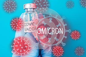 Omicron vaccine,vaccination against a new variant of the coronavirus strain,vial with an injection from covid 19 in the hands of a