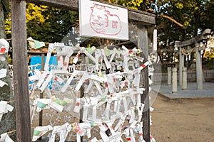 Omikuji tie at  Achi Shrine in Kurashiki, Okayama, Japan. The Omikuji tie is made to drive away bad