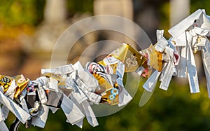 Omikuji tied to a wire