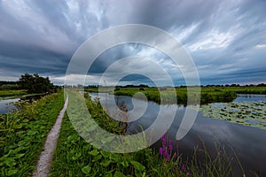 Ominous clouds over the Dutch polder landscape