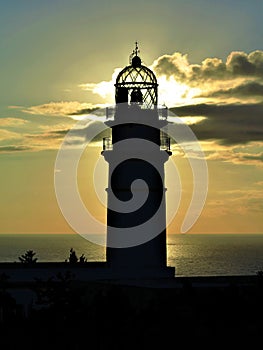 Ominous lighthouse morning sunrise on the Med photo