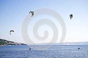 OMIS, CROATIA, SEPTEMBER 18, 2020 - Tourists enjoying kitesurfing during a windy sunny day in Omis Resort, Croatia.