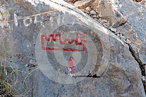 Omis - Directional path mark written on rock leading the way to Fortress Starigrad in Omis, Split-Dalmatia, South Croatia, Europe