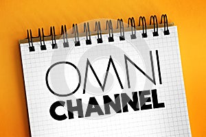 Omni channel - neologism portmanteau describing an advertising strategy, text concept on notepad