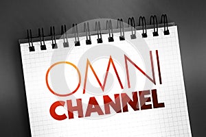 Omni channel - neologism portmanteau describing an advertising strategy, text concept on notepad