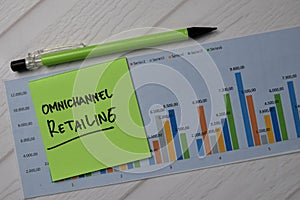 Omnichannel Retailing write on sticky notes with graphic on the paper isolated on office desk