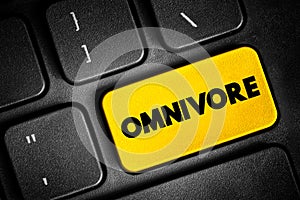 Omnivore is an organism that eats plants and animals, text button on keyboard, concept background