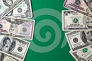 Ð¡omparison between american dollar bills on green background. Billiards table. Gambling concept - bet in games
