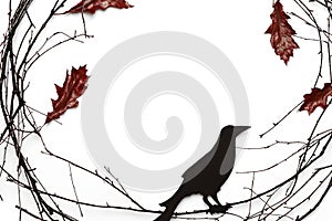 Ð¡omposition of branches, red leavese and carved raven on white background