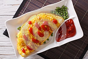 Omurice omelet stuffed with rice closeup. Horizontal top view