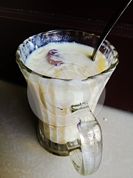 Onam special Vermicelli payasam made of milk in a glass with spoon.