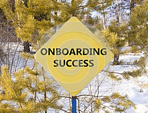 Onboarding success symbol. Concept words Onboarding success on beautiful yellow road sign. Beautiful forest snow blue sky