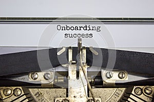 Onboarding success symbol. Words Onboarding success typed on retro typewriter. Business and onboarding success concept. Beautiful