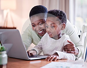 Once a mother, always a mother. a mother helping her son with his homework at home.