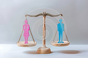concept of gender equality. Scales with pink female figure and blue male figure. Equivalence, equal rights, gender equality, photo