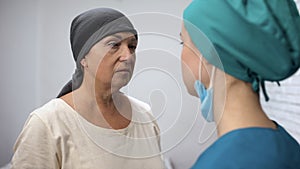Oncologist informing hopeless patient about metastases, cancer awareness concept photo