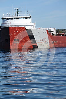 Oncoming close shot of cargo ship leaving port in Lake Superior Minnesota