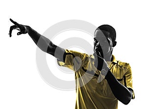 One african man referee whistling pointing silhouette