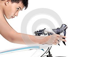 One asian boy practicing man road bike bking isolated on white background