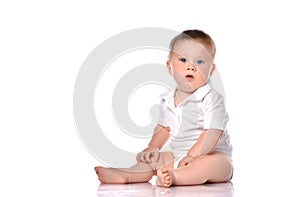 One baby boy with funny cute expression isolated on white.