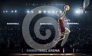 One basketball player jump in stadium panorama view