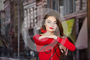 One beautiful female caucasain high school senior girl in red crop top sweater photo