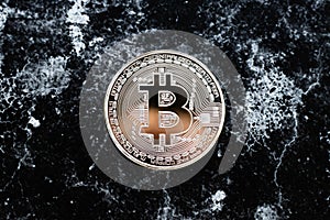 One bitcoin on dark background. E-commerce concept. Cryptocurrency