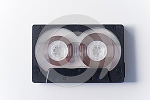 One black audio cassette on white background