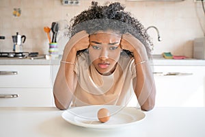 One black woman feeling hungry eating poor calories food for diet