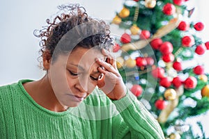 One black woman feeling sad and depressed during christmas