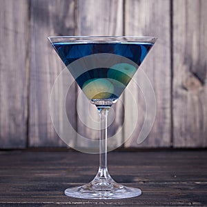 One blue cocktail martini, close up