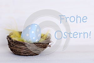 One Blue Easter Egg In Nest With German Frohe Ostern Means Happy Easter